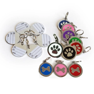 Colorful pet ID tags set with paw and bone designs for dogs and cats on white background