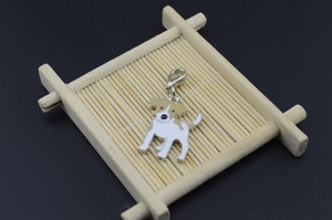 Macro shot of silver Jack Russell Terrier enamel dog pendant with lobster clasp attachment