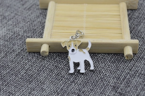 Detailed view of Jack Russell Terrier dog charm with white enamel and silver lobster clasp