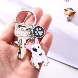 Creative Bull Terrier keychain with white dog pendant and black paw print charm