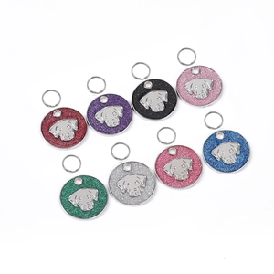 Set of 8 colorful glitter metal pet ID tags with dog head relief on white background