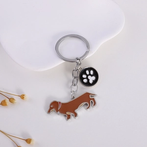 Creative dachshund enamel keychain with silver-tone metal chain and cute paw print charm