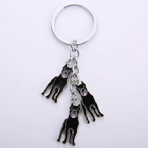 Detail of three black Great Dane dog charms on silver metal keyring with enamel finish