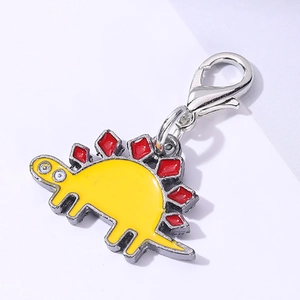 Cute yellow enamel stegosaurus dinosaur charm with red plates and a silver lobster clasp