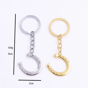 Minimalist horseshoe metal keychain in gold and silver finish with detailed dimensions