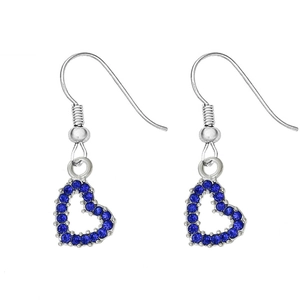 Close-up of silver heart-shaped pendant earrings with blue rhinestones on white backdrop