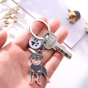 Rottweiler metal keychain with paw print pendant and enamel dog charm accessory