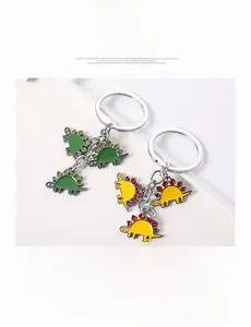 Detail showing colorful zinc alloy cartoon dinosaur keychains with enamel finish