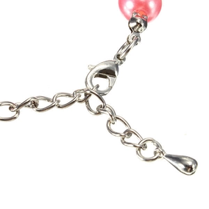 Close-up of pink pearl pet necklace lobster clasp and silver extension chain