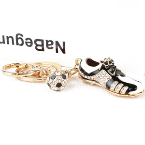 Sparkling crystal football shoe keychain with golden soccer ball and spring hook