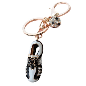 Sparkling soccer shoe and ball keychain in rose gold with rhinestone embellishments