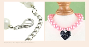 Detail of pink pearl pet necklace featuring a black glitter heart pendant with Love engraving