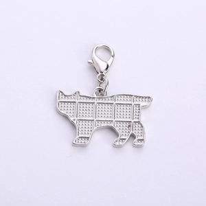 Detailed macro view of the grid pattern and texture on the silver cat pendant back
