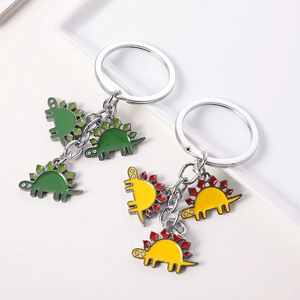 Cartoon stegosaurus dinosaur metal keychain with green and yellow enamel pendants