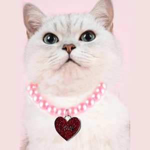 Pink pearl pet necklace for cats with a red glitter heart pendant engraved with Love