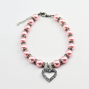 Detail of pink faux pearl pet collar with crystal heart pendant and lobster clasp