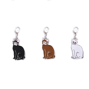 Three cute cartoon alloy cat charms in black brown and white with lobster clasps