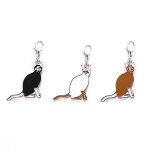 Three-piece set of cat pendant charms with lobster clasps in black, white, and brown colors