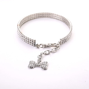Detailed view of three-row rhinestone pet collar with sparkling bone charm and lobster clasp