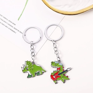 Porte-clés mignons en alliage de zinc avec dinosaures et guitare sur fond blanc épuré