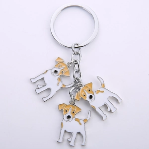 Detailed view of three metal Jack Russell Terrier charms on a silver keychain