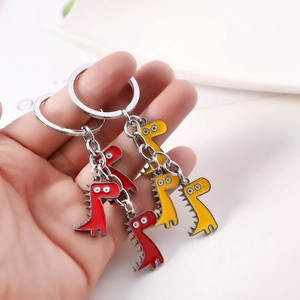 Porte-clés dinosaures mignons en alliage de zinc en couleurs rouge et jaune vif