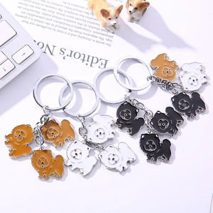 Cartoon Chow Chow metal keychain set in brown, white and black finishes for pet lovers