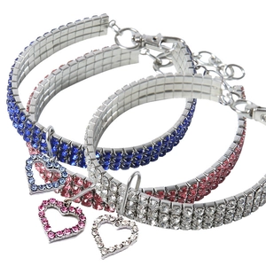 Three-row rhinestone pet collars with heart pendants in blue, pink, and white crystal colors