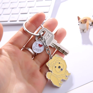 Detail of yellow enamel Chow Chow keychain with I Love Dogs tag and silver ring