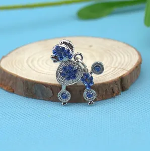 Sparkling silver poodle pendant with blue rhinestones for pet collars and necklaces