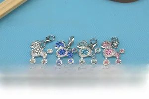 Detailed close-up of four-color poodle dog pendant charms with sparkling rhinestones