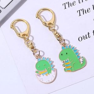 Porte-clés dinosaures mignons en métal vert avec fermoirs dorés et détails soignés