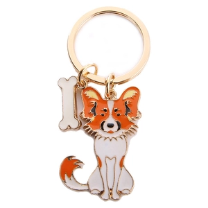 Creative metal Papillon dog keychain with orange enamel charm and white bone pendant