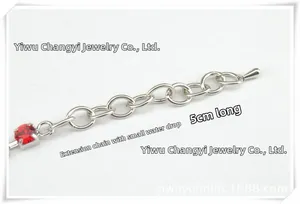 Detailed close-up of a 5cm silver extension chain with red gemstone and water drop charm