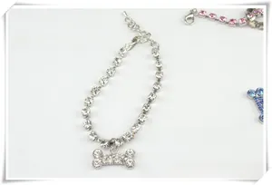 Detail of rhinestone dog bone pendant necklace with adjustable chain and lobster clasp