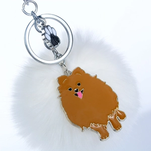 Porte-clés chien Loulou de Poméranie avec pompon blanc et petit pendentif patte