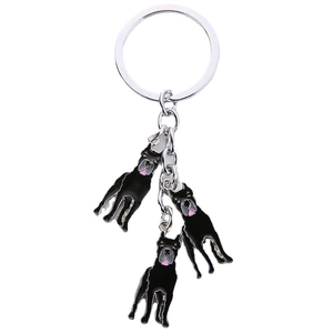 Silver alloy keychain featuring three black and white enamel dog pendants for bag decor