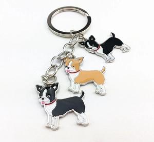 Detail of metal Boston Terrier charms with enamel oil finish on a silver keychain