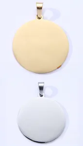 Close-up of circular stainless steel pet ID tags in polished gold and silver finishes