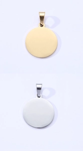 Detailed view of polished round stainless steel pet ID tags in gold and silver finish