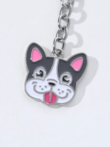 Detailed close-up of a French Bulldog enamel keychain with high-quality metal finish