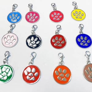 Detailed grid of colorful round pet tags with paw print cutouts and lobster clasps