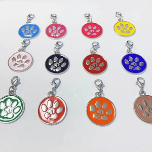Colorful zinc alloy pet ID tags with hollow paw prints and lobster clasps for cats and dogs