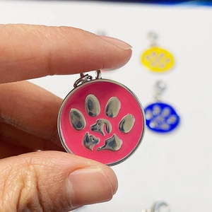 Pink paw print pet ID tag with cat dog silhouettes in round zinc alloy metal
