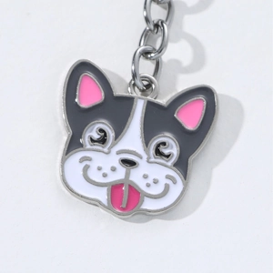 Cartoon French Bulldog enamel keychain with silver metal chain on white background