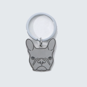 Artistic bulldog pet keychain pendant made of matte silver stainless steel on grey background