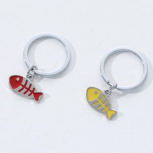 Modern zinc alloy fish bone keychains in bright red and yellow with polished metal rings