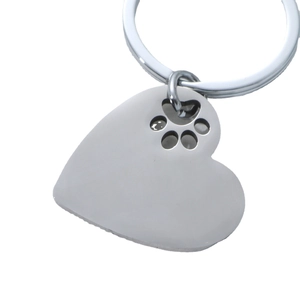 Polished stainless steel heart keychain with a minimalist hollowed pet paw print design