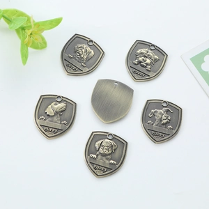 Antique bronze shield-shaped pet ID tag with puppy bone relief for custom engraving