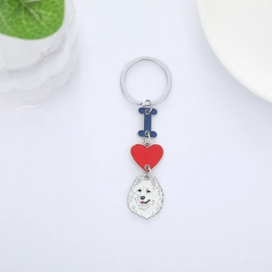 Detail view of I Love Samoyed keychain with blue enamel letter and red heart pendant
